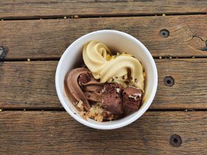 Passionfruit cheesecake and choc hazelnut froyo topped with passionfruit pulp, home made aero style pieces and carrot cake crumbs at goje in Yarraville