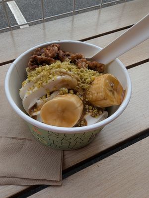 vanilla and coconut froyo, caramelised bananas, pistachio crumb, candied walnuts (pistachio Froyo and blondie underneath) at goje in Yarraville