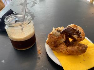 Croissant with chia and chocolate and ice coffe at Dulcamara Bio Vegan Bistrot in Verona