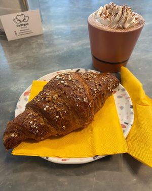 Croissant and hot chocolate  at Dulcamara Bio Vegan Bistrot in Verona