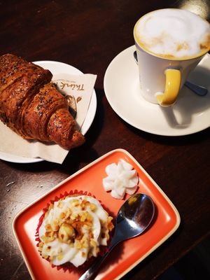 Croissant, cappuccino and gluten-free mini-cake at Dulcamara Bio Vegan Bistrot in Verona