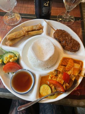 Three small dishes, one is tofu in red curry.   at Usagi in Gothenburg