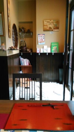 Entrance with sliding doors seen from the inside. The restaurant is decorated in a Japanese style. at Ajyari in Osaka