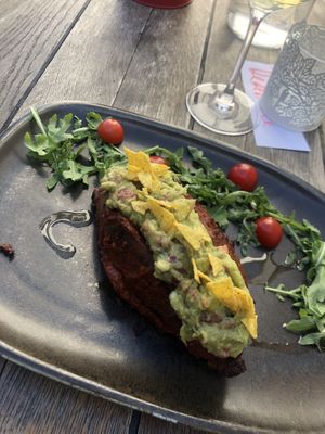 Pečené batáty plněné guacamole at Vegan's Prague in Prague