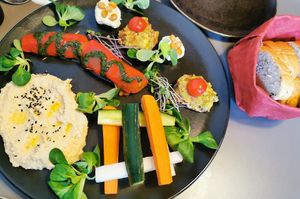 Variation of starters and fresh bread at Vegan's Prague in Prague