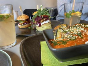 Homemade lemonade, selection of mini-burgers & zucchini lasagne 😋  at Vegan's Prague in Prague