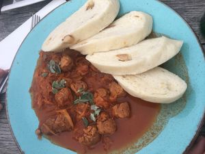 Tofu cabbage goulash with fluffy dumplings  at Vegan's Prague in Prague