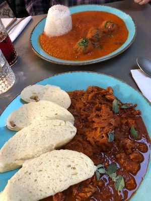 Far plate - quinoa balls in tomato sauce. Delicious sauce!!
Near plate - goulash with soya (I think) chunks and red cabbage and dumplings. Just yum! at Vegan's Prague in Prague