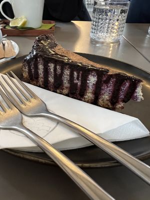 Poppyseed cheesecake with blueberry sauce  at Vegan's Prague in Prague