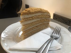 The honey cake is great but I should have had a tea with it!  at Vegan's Prague in Prague
