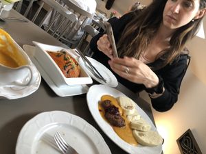 The lasagne and dumplings get thoroughly photographed !  at Vegan's Prague in Prague