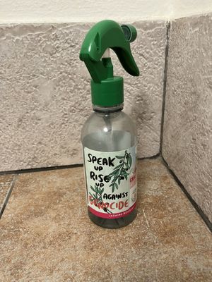 A message in the restroom: ”Against genocide!"  at Vegan's Prague in Prague