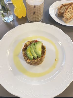 Tomato-avocado tartare with toast and garlic oil  at Vegan's Prague in Prague