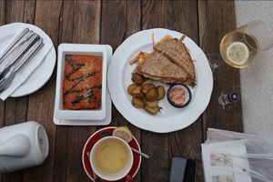 •Our sandwich with baked potatoes 
•Zucchini lasagna with spinach and parmesan  at Vegan's Prague in Prague