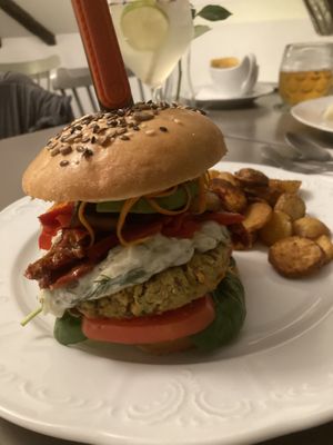 Chickpea basil burger with roast potatoes   at Vegan's Prague in Prague