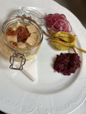 Cashew cheese with tofu and pickles and bread   at Vegan's Prague in Prague