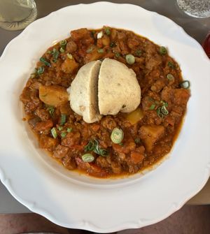 lentil goulash with soy cubes, oyster mushroom, vegetables and dumplings!  at Vegan's Prague in Prague