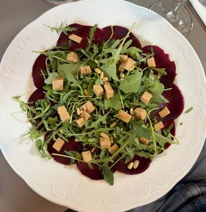 beetroot carpaccio with cashew cheese, pine nuts and pumpkin seed oil!  at Vegan's Prague in Prague