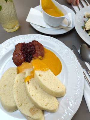 Traditional dumplings with special sauce and "steak" at Vegan's Prague in Prague