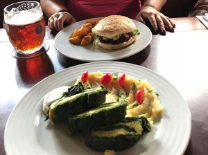 Burger and daily special spinach rolls at Vegan's Prague in Prague