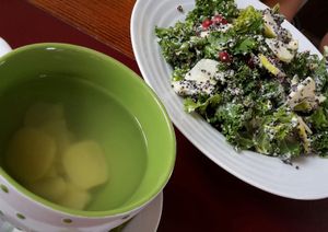 homemade ginger tea & quinoa salad with kale, apple and tasty dressing  at Vegan's Prague in Prague