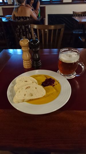 Svíčková with dumplings, smoked tempeh and cranberry jam together with Vinohradska pivo at Vegan's Prague in Prague