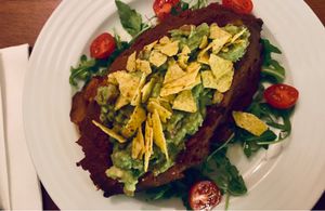 Baked sweet potato with avocado at Vegan's Prague in Prague