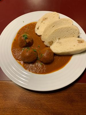Quinoa balls in tomato sauce with local dumplings  at Vegan's Prague in Prague