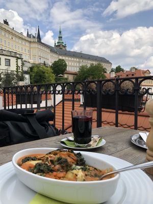 Zucchini lasagna and hot wine  at Vegan's Prague in Prague