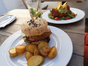 Daily burger and guacamole sweet potatoes. at Vegan's Prague in Prague