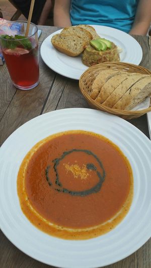 Soup of the day with avocado tartar and bread at Vegan's Prague in Prague