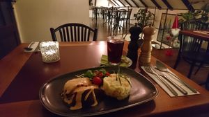 Smoked watermelon with potato salad at Vegan's Prague in Prague