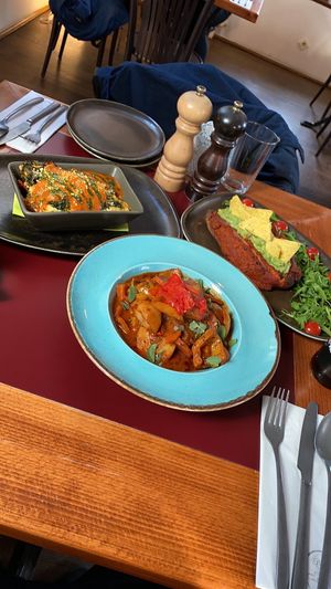 Eggplant lasagna, Potato Goulash and Sweet Potato with Guac at Vegan's Prague in Prague