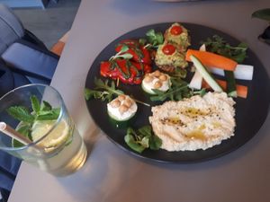 Mixed starter plate (suitable for 2 ppl) contains: Hummus, cucumber, guacamole, red pepper with pesto topping. And the homemade limo :-) at Vegan's Prague in Prague