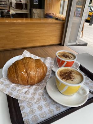 Chocolate croissant and coffees. at Crois-Sants in Barcelona