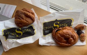 Fran left: Savoury croissant (hot dog), banana chocolate croissant,  mini plain croissant and a half chocolate dipped croissant - all vegan   at Crois-Sants in Barcelona