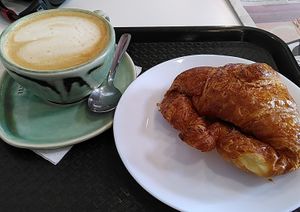 Plain croissant and coffee with soy milk at Crois-Sants in Barcelona