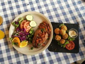 Breaded mushrooms & BBQ baked jacket potato with baked beans at O Forno in Calheta