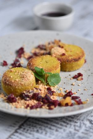 TOFNIKI WITH CRANBERRY, RAISINS, NUTS AND BERRY SAUCE at Vegano Hooligano - Mala in Odessa