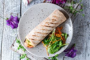 Vegan dog with carrots, ginger, cheese tomato-basil sauce at Vegano Hooligano - Mala in Odessa