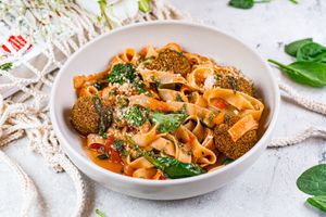 Fettuccine in tomato-basil sauce with mit-balls and parmesan at Vegano Hooligano - Mala in Odessa