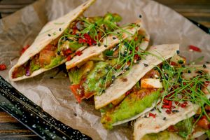 Braed unleavened with green pea mousse, tomatoes and vegan cheese 1/200 gr at Vegano Hooligano - Mala in Odessa