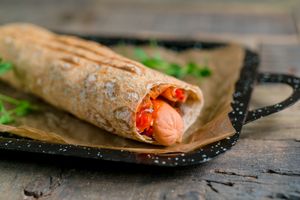 Vegan dog with carrots, ginger, cheese, falafel and BBQ sauce in pita (300g) at Vegano Hooligano - Mala in Odessa