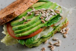 HELSEY TOAST WITH AVOCADO, TOFU AND FRESH VEGETABLE MIX at Vegano Hooligano - Mala in Odessa