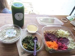 raw beetrot burger, kale chips, raw hummus, green juice. at Vegan & Raw in Mallorca