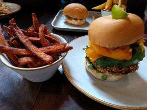 Thai vegetable burger with a vegan cheese slice plus sweet potato fries at Handmade Burger Co in Manchester