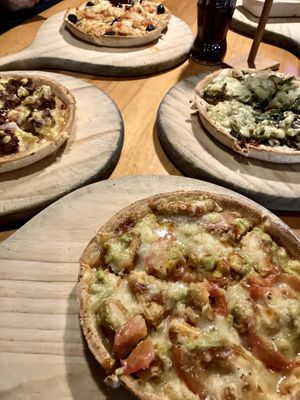 Burger pizza (left), mischief (top), damned (right), brimstone (bottom)  at Hell Pizza in Queenstown