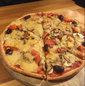 Custom pizza (vegan cheese, mushrooms, olives, etc) at Hell Pizza in Queenstown