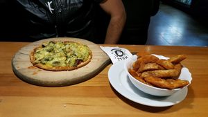 GF and vegan Damned with a side of Cajun wedges at Hell Pizza in Queenstown