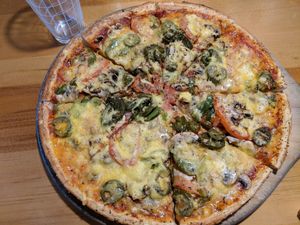 Pride with vegan cheese. at Hell Pizza in Queenstown